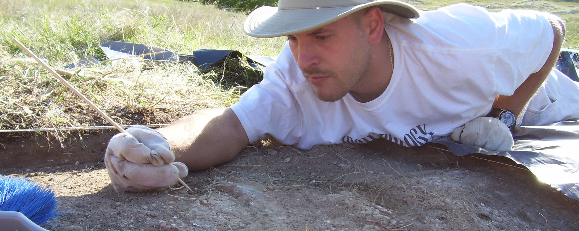 student digging at Nicodemus archeology dig
