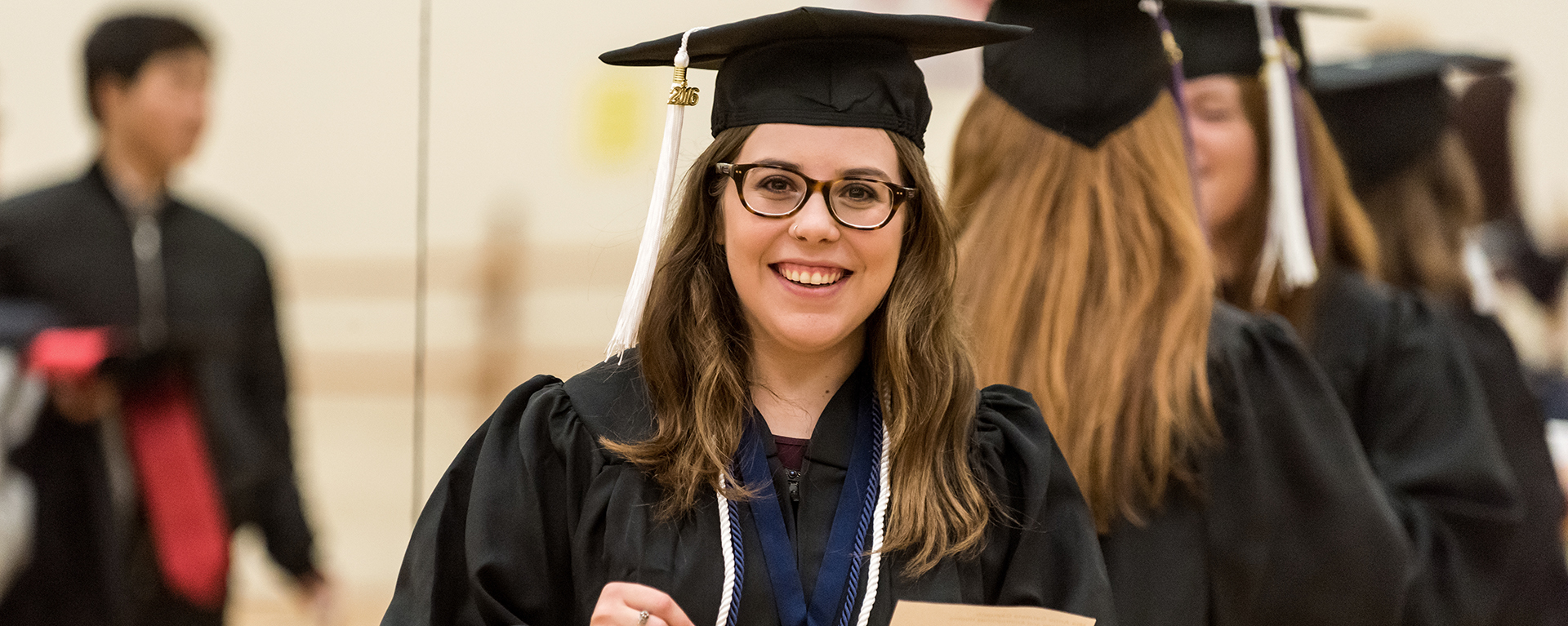 A Washburn student prepares for the graduation ceremony at Lee Arena in 2016.
