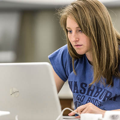 A forensics student stares at her laptop
