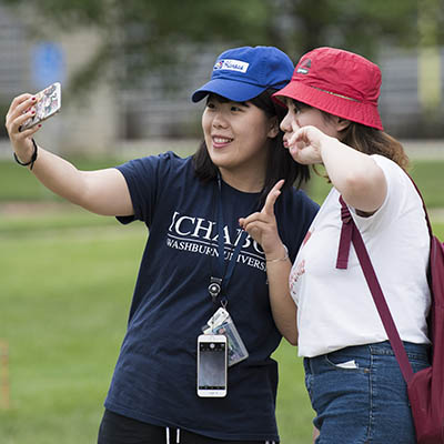 International students pose for a photo at an on campus event.