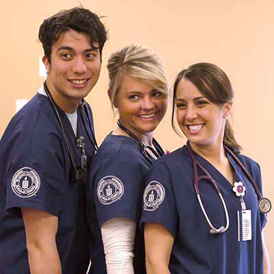 Three nursing students smiling