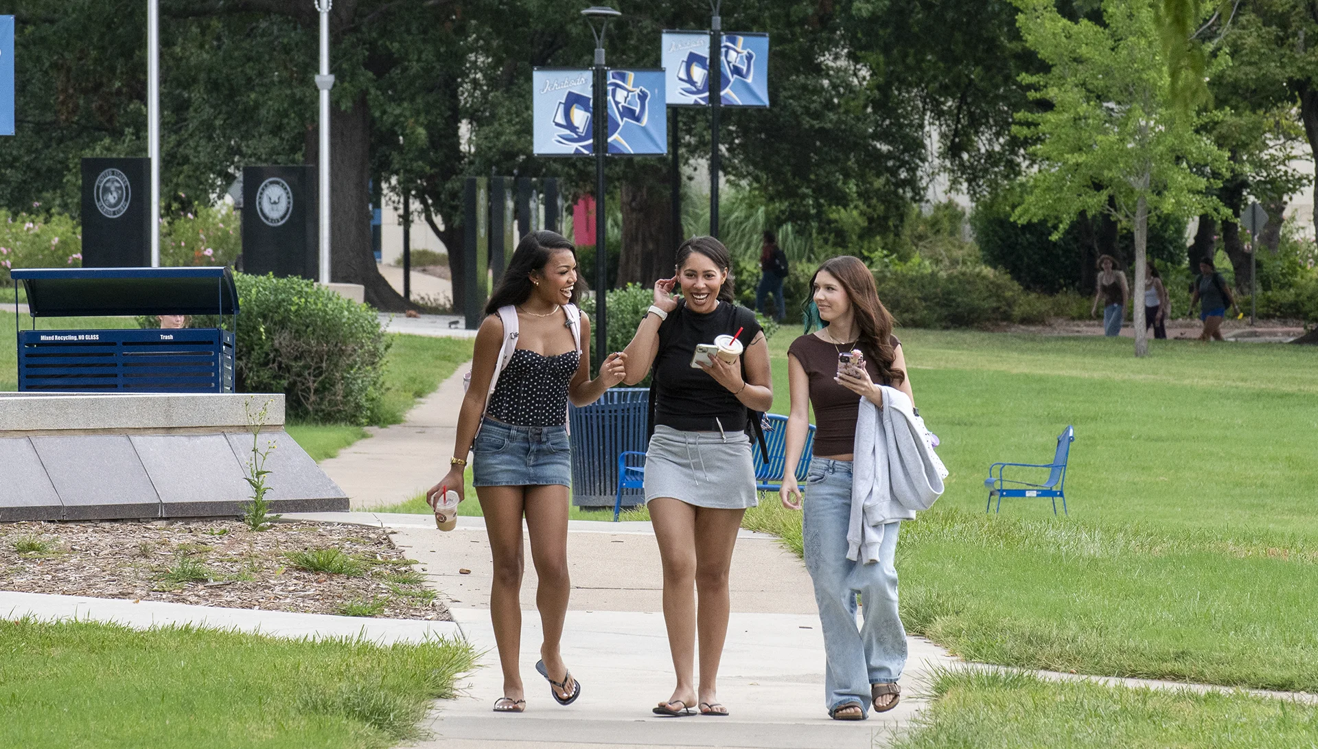 Washburn students laugh while walking to class.