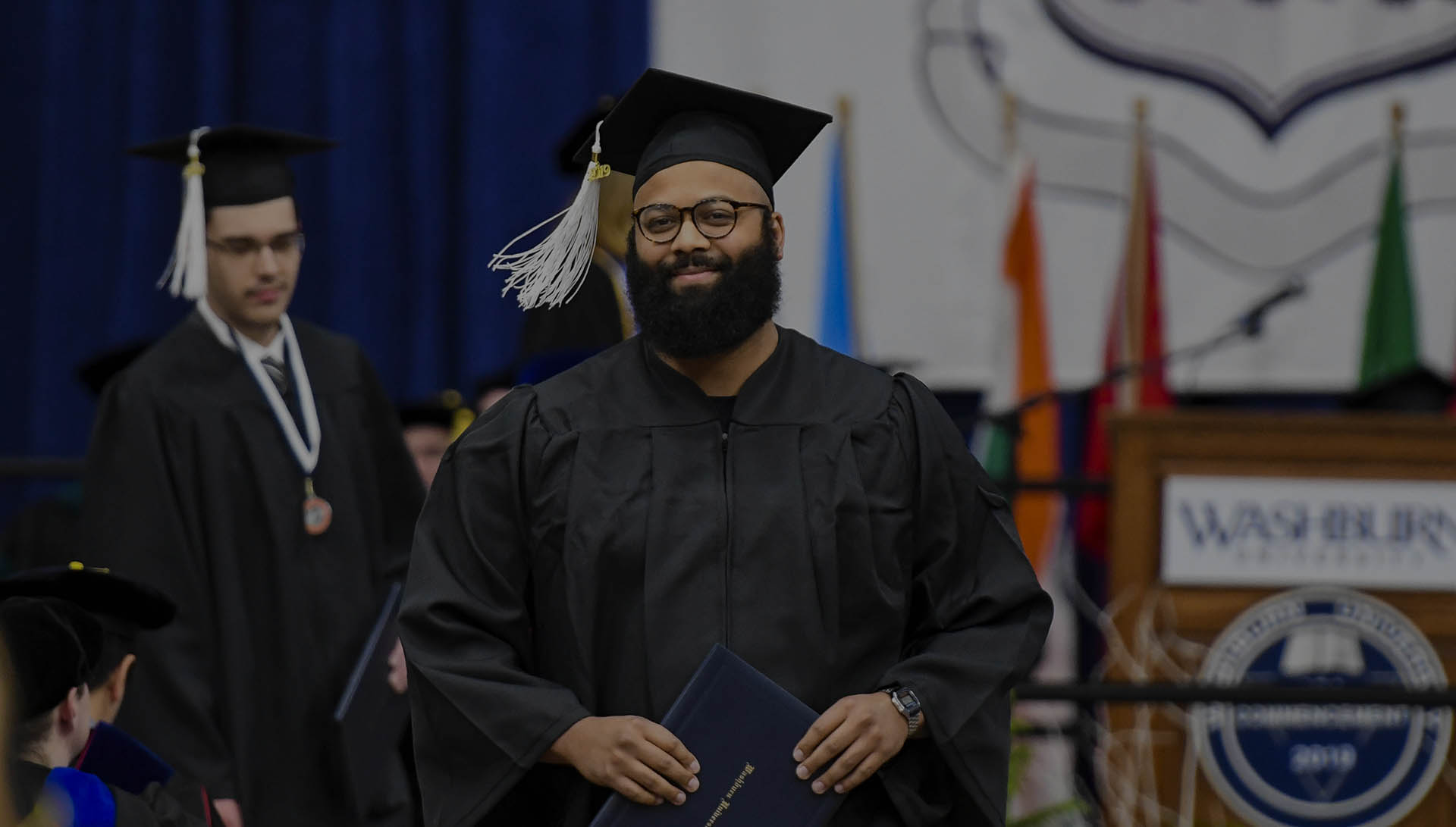 Student smiling at graduation in regalia