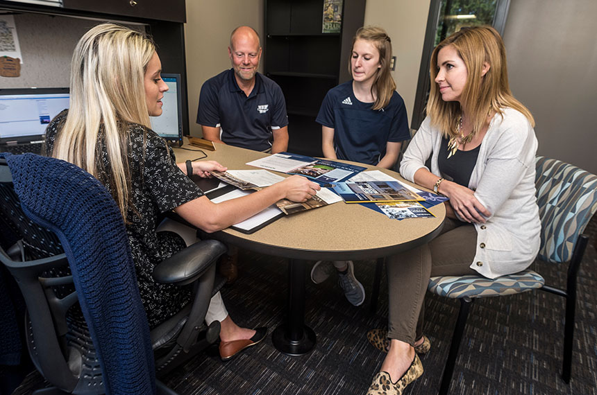 Group of people at office table in discussion