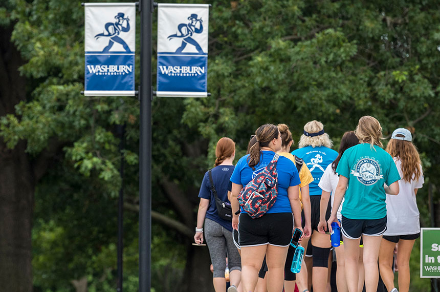 group of students walking on campus