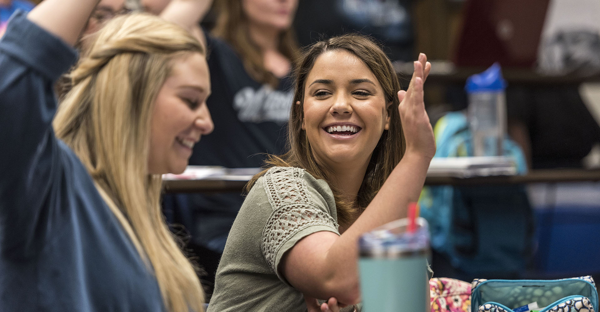 female students smiling in class