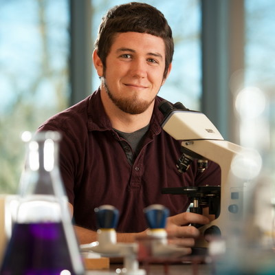 male student science classroom