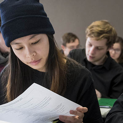 A student looks at a paper in class