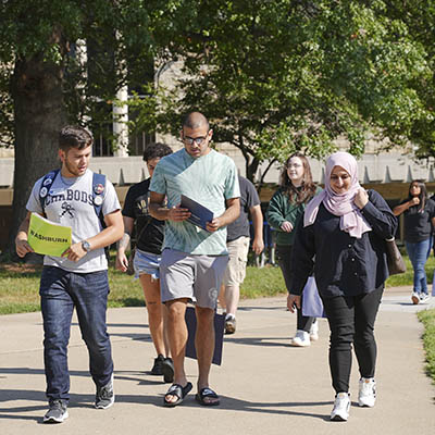 Students smile while on a tour during orientation.