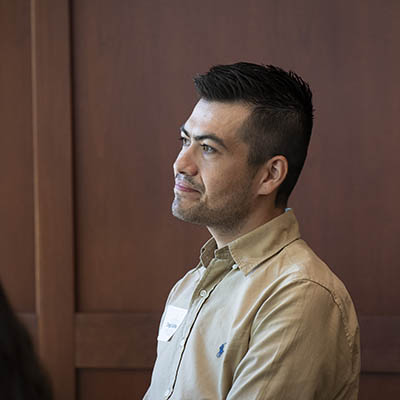 An adult learner seated, listening