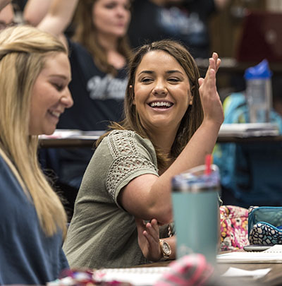 A student laughs during a class at Henderson Learning Center at Washburn