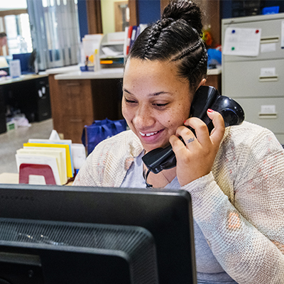 A staff member talking on the phone
