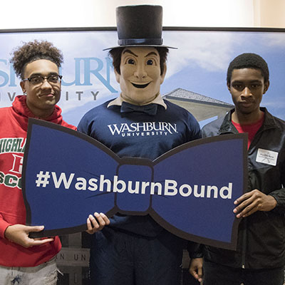 Highland Park High School students take a photo with Mr. Ichabod during a Washburn scholarship night