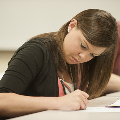 A student works on an assignment during class