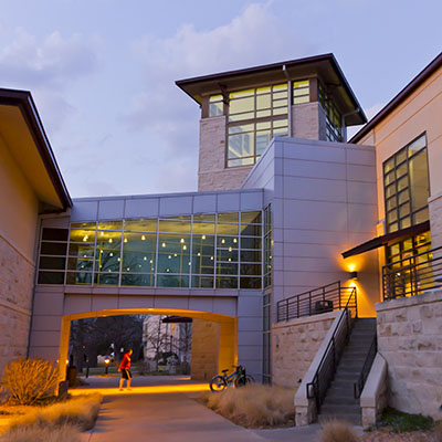 The Living Learning Center and atrium on an early evening