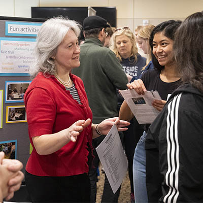 A professor gestures while talking about her field with a prospective student at Ichabod Junior Day.