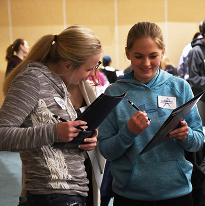 Visiting students go over their options during Ichabod Day at Washburn