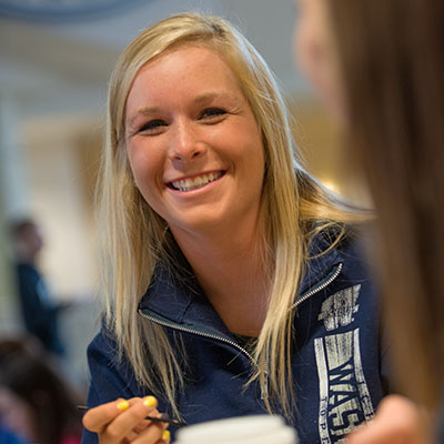 A Washburn student shares a laugh with a friend at the Memorial Union