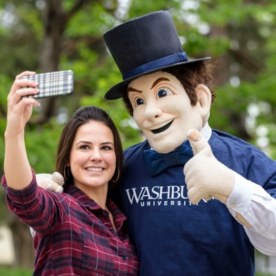 A Washburn student takes a selfie with Mr. Ichabod