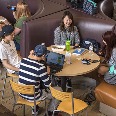 Washburn students share their lunch break in the Union Market of the Memorial Union.