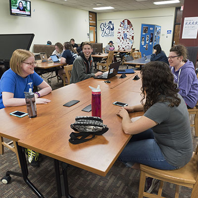 Students work on a project together in Mabee Library on Washburn's campus.