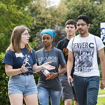 A peer educator leads a tour around campus.