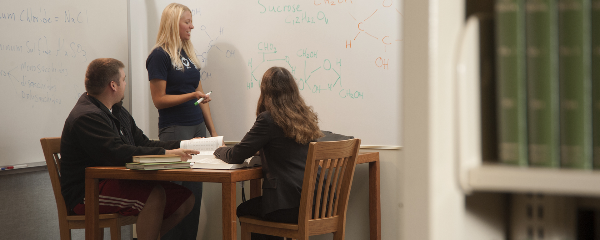 Washburn students work together on a group assignment in Mabee Library.