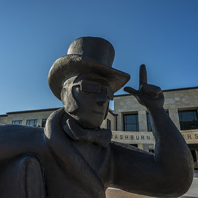 The Ichabod statue is located in the front of the Welcome Center at Washburn.
