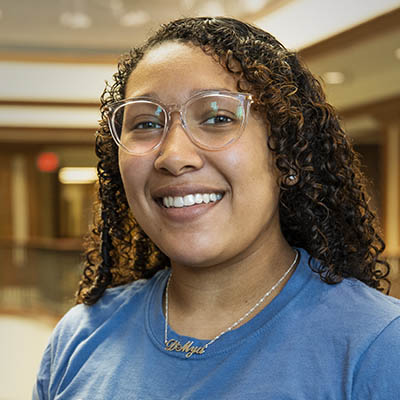 D'Mya Valdivia smiles while wearing a Washburn shirt.