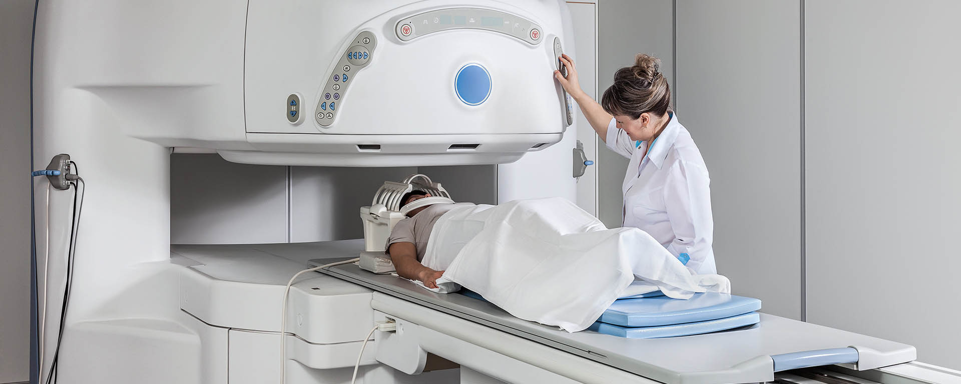MRI machine operator with a patient