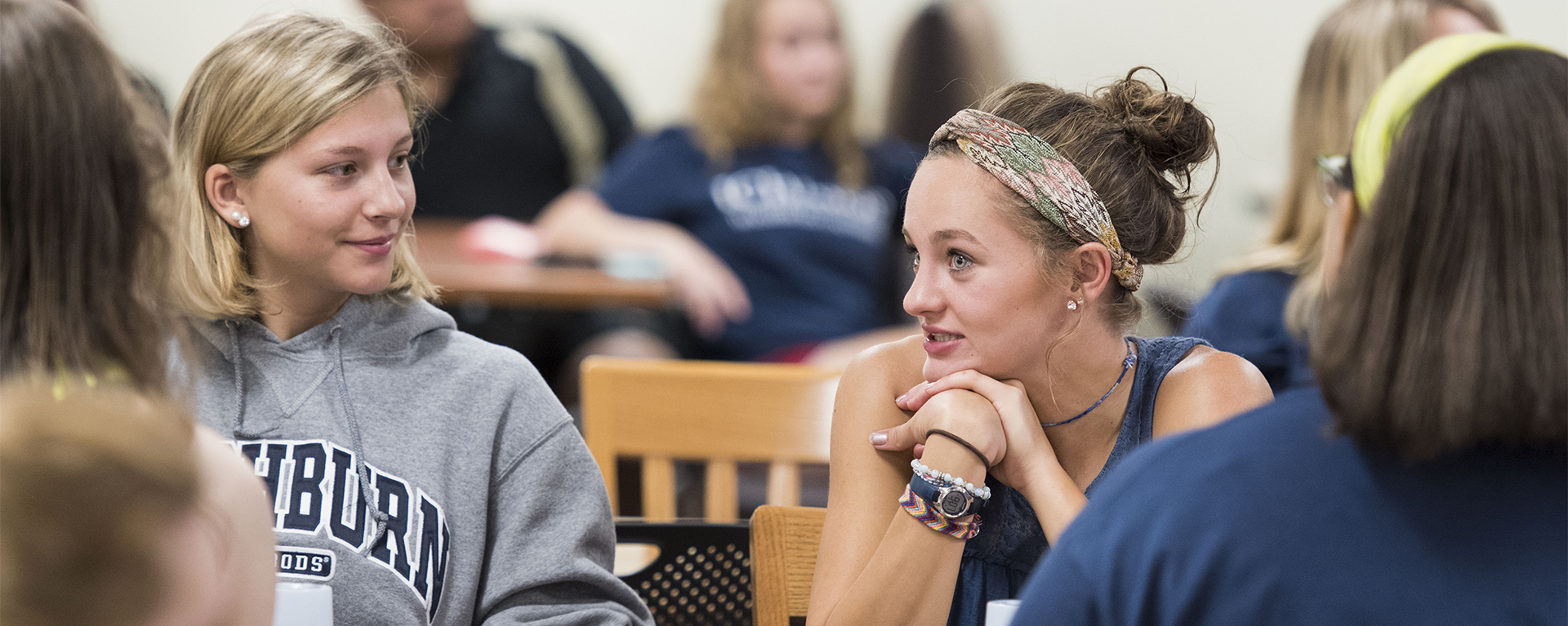 Students talking in the library.