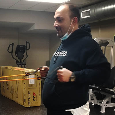 WU Moves client works to build muscle endurance with resistance band.
