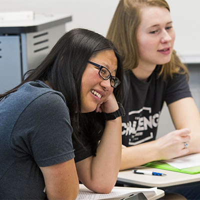 A student smiles while in class.