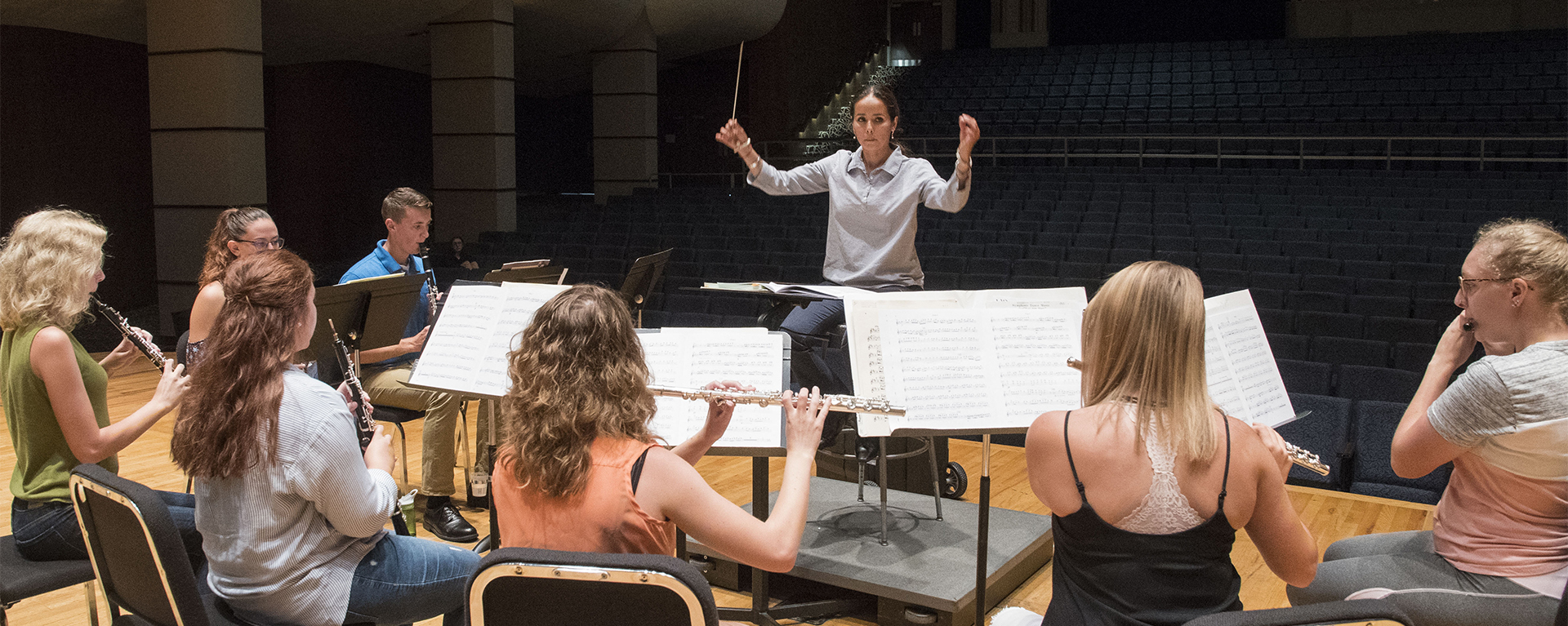 A professor conducts an ensemble 