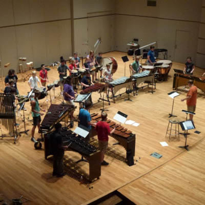 A group of campers play instruments in White Concert Hall.