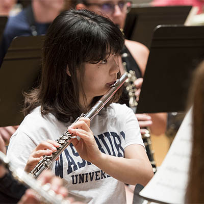 student using wind instrument