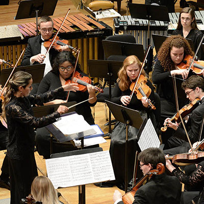 Students part of the orchestra give a performance