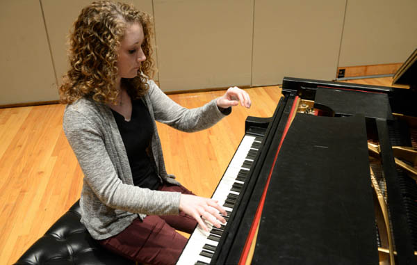 Student playing the piano