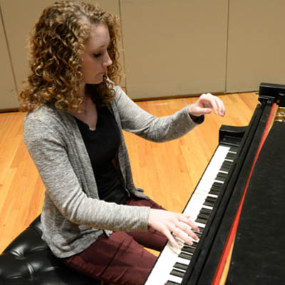 Student playing the piano