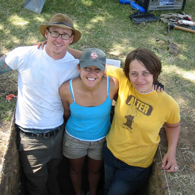 Students standing in a hole
