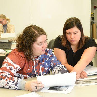 Students discussing photos