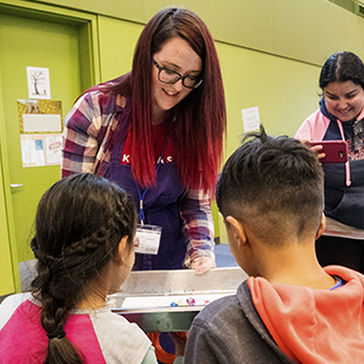 Sarina Smith does an art project with kids.