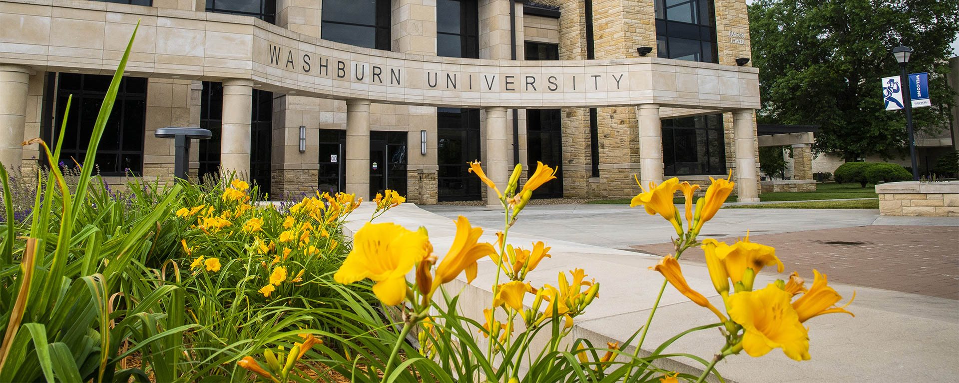 Flowers bloom in front of Morgan Hall.