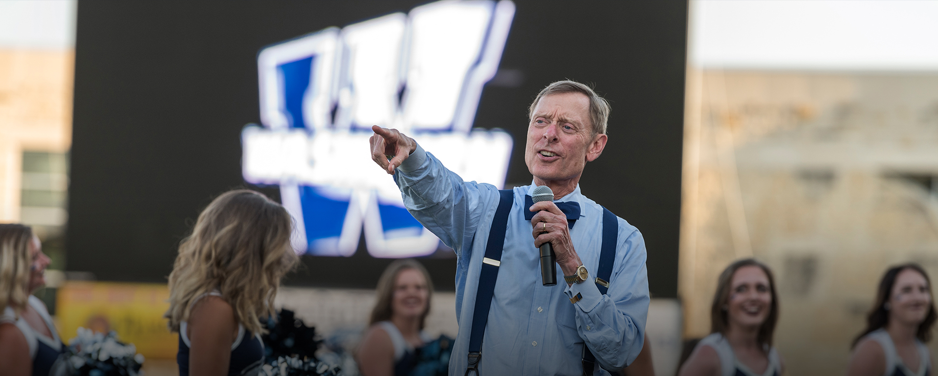 President Farley speaking at a sporting event