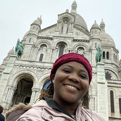 Noel smiling in front of Sacré-Coeur