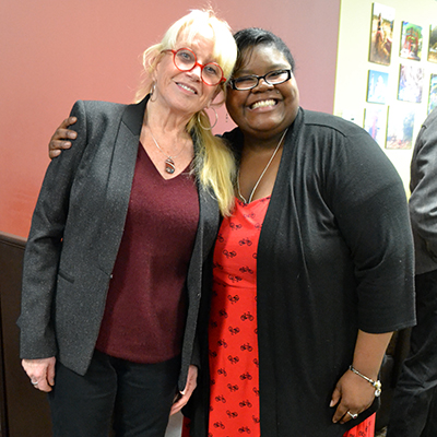 Patricia Traxler and Jossie Hicks standing next to each another in Mabee Library