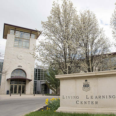 Memorial Union east entrance with Living Learning Center sign.