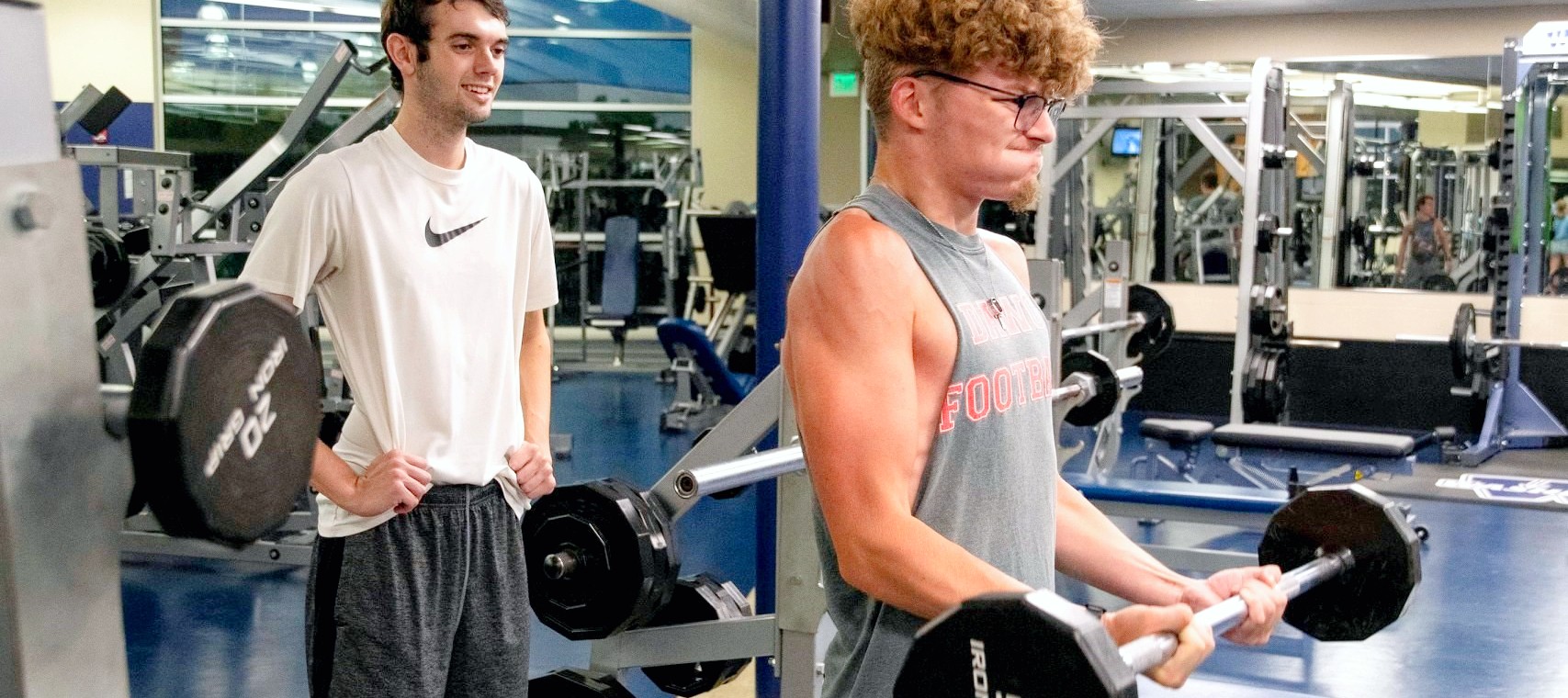 student lifting weights