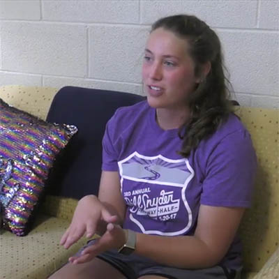 student seated and speaking in counseling services office 