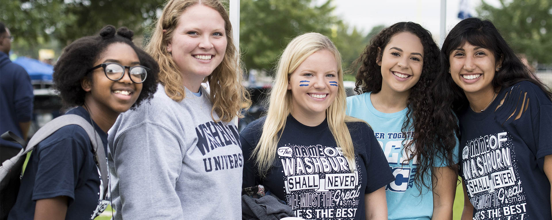 CAB members smile while tailgating